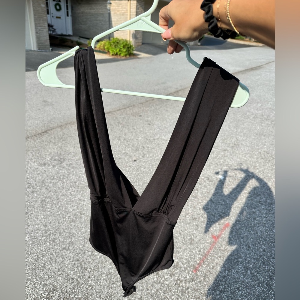 Deep V neck low cut backless black bodysuit